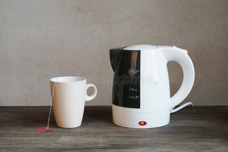 Tea making facilities with electric water kettle, teacup and teabag. Tea making facilities with electric water kettle, teacup and teabag