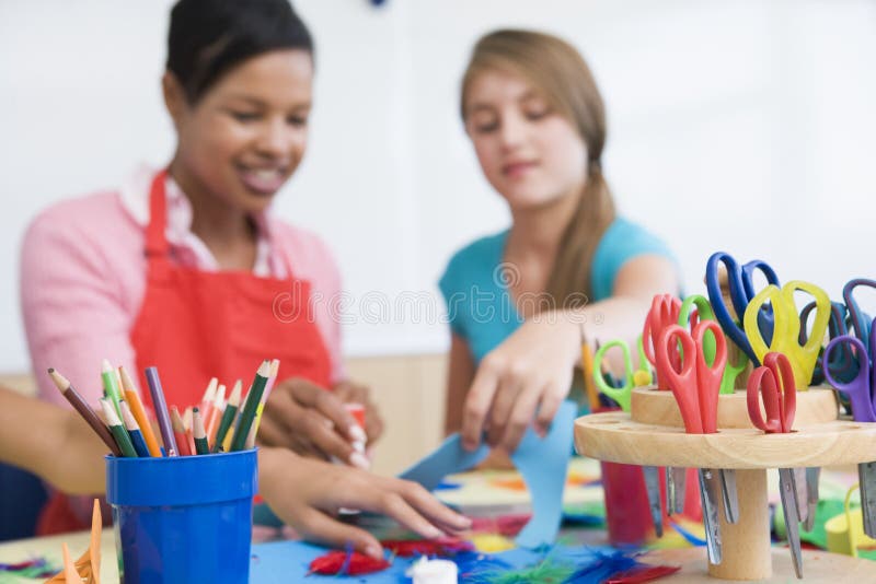 Elementary school art class with teacher