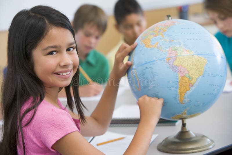 Elementary school geography class with globe