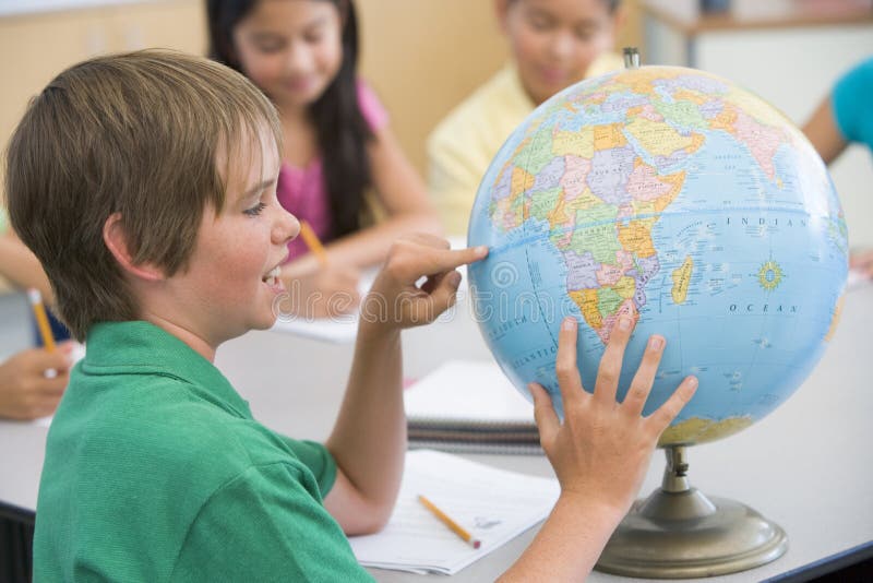 Elementary school geography class with globe