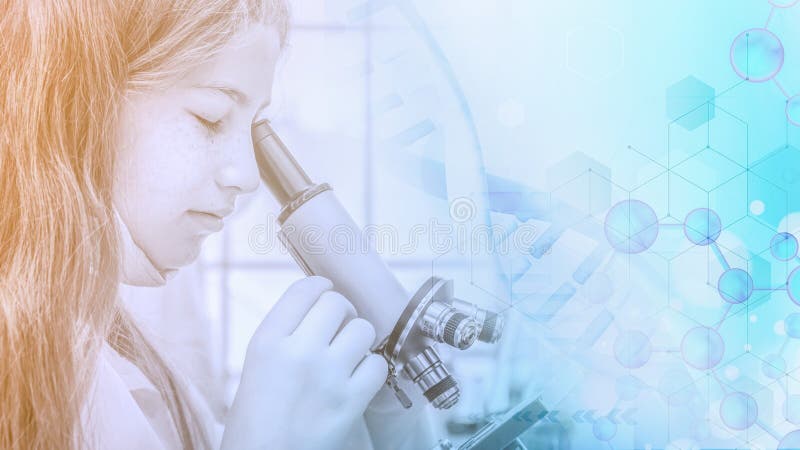 Elementary school student girl uses a microscope for science project in laboratory stock image