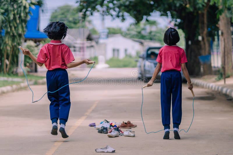 Elementary school students enjoy rope jump training for good health before lunch at school.