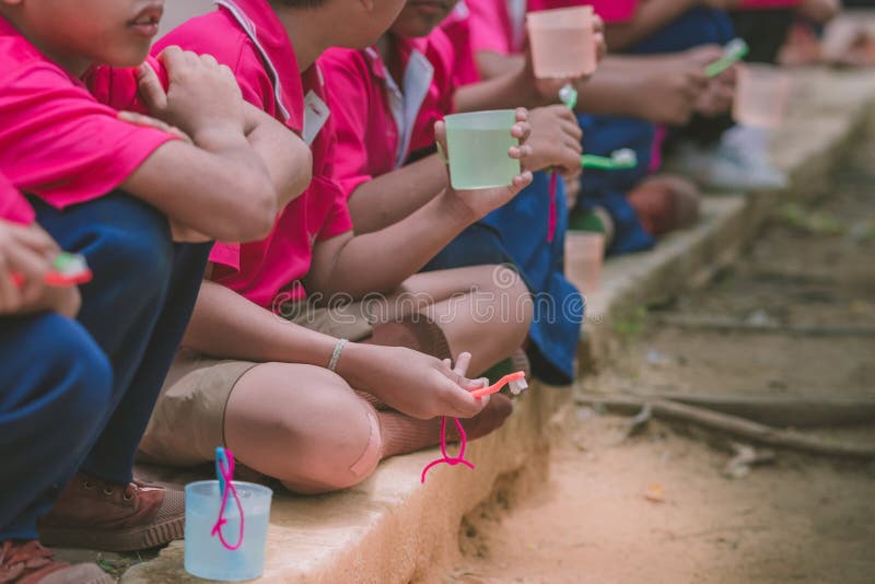 Elementary Students brush their teeth stock image