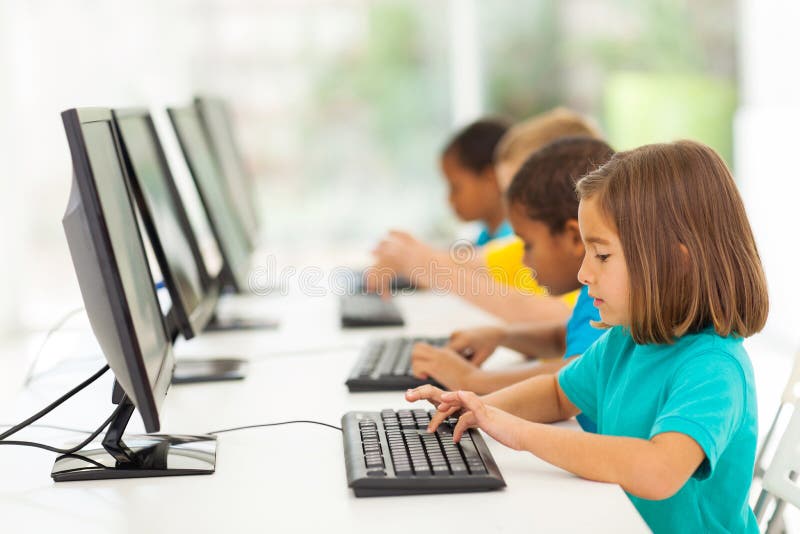 Group elementary school students in computer class. Group elementary school students in computer class