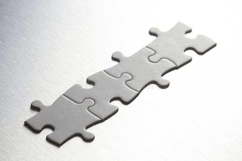 A 4 elements joined together. teamwork concept and company creation. very small depth of field. selective focus. space for copy. space for text