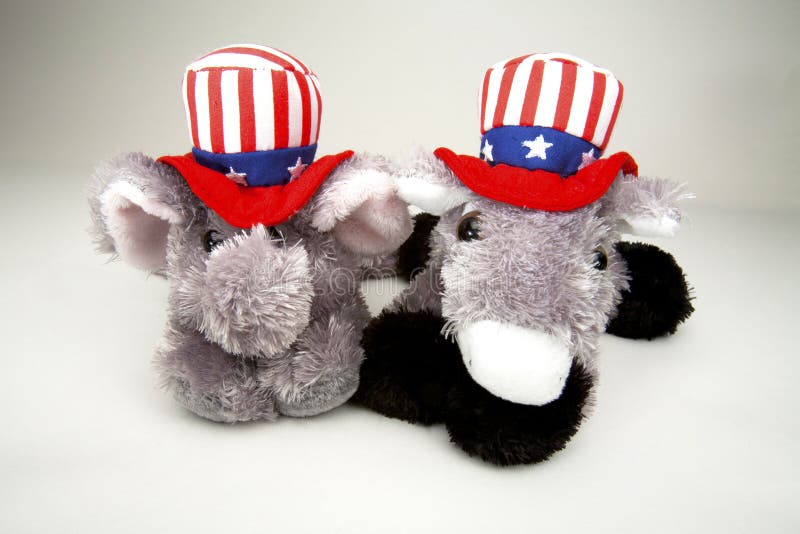 Elephant representing the Republican Party and Donkey representing the Democratic Party in red, white and blue Stars and Stripes hats. Elephant representing the Republican Party and Donkey representing the Democratic Party in red, white and blue Stars and Stripes hats.