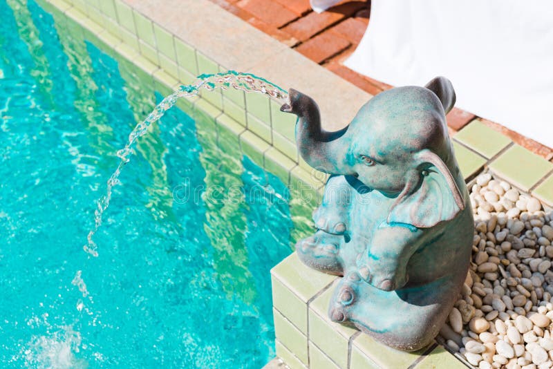 Elephant statue at pool stock photo. Image of fountain 39247870