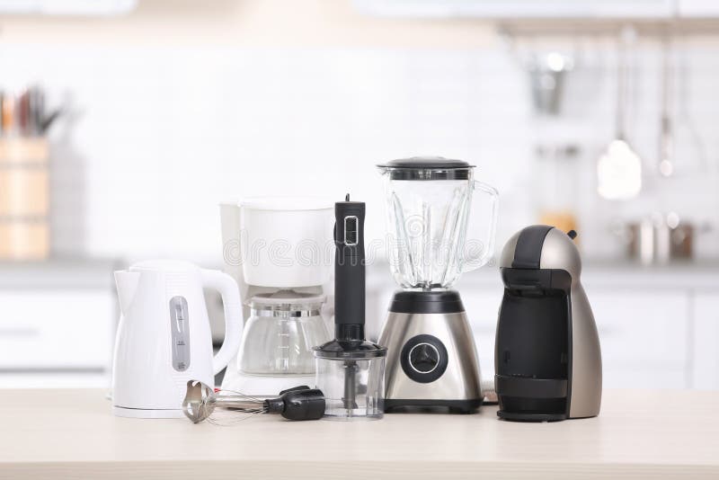 Different modern kitchen appliances on table indoors. Interior element. Different modern kitchen appliances on table indoors. Interior element