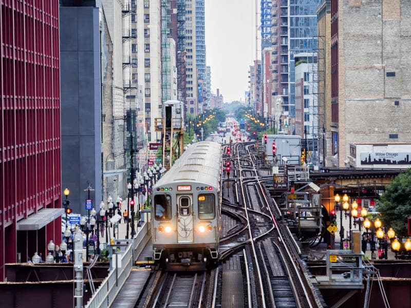 Elevated Train Tracks Above the Streets and between Buildings at the
