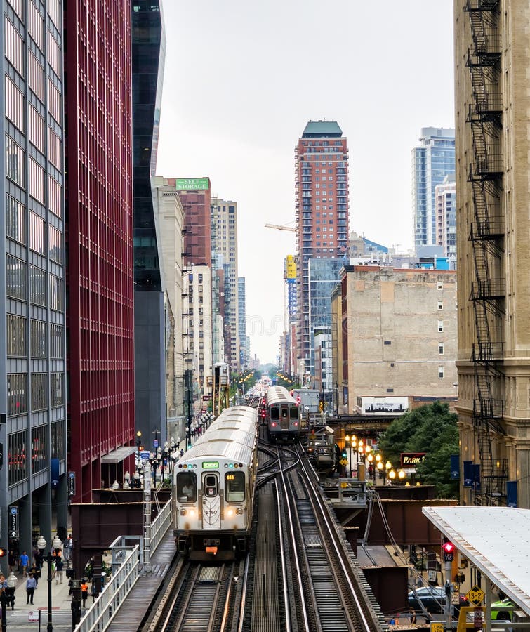 Elevated Train Tracks Above the Streets and between Buildings at the