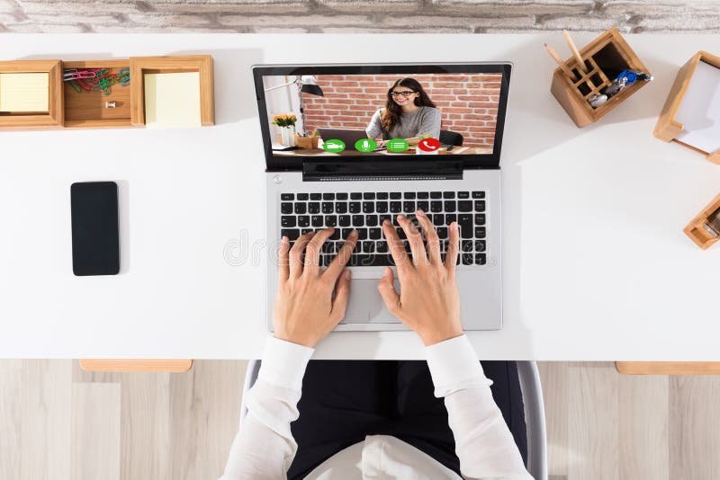 Elevated View Of Businessperson Videoconferencing On Laptop stock images Elevated View Of Businessperson Videoconferencing On Laptop stock images