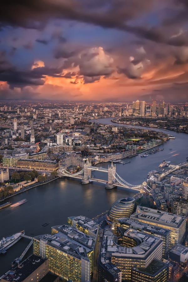 Elevated view of the London skyline: from the Tower Bridge to the financial district Canary Wharf just after sunset, United Kingdom. Elevated view of the London skyline: from the Tower Bridge to the financial district Canary Wharf just after sunset, United Kingdom