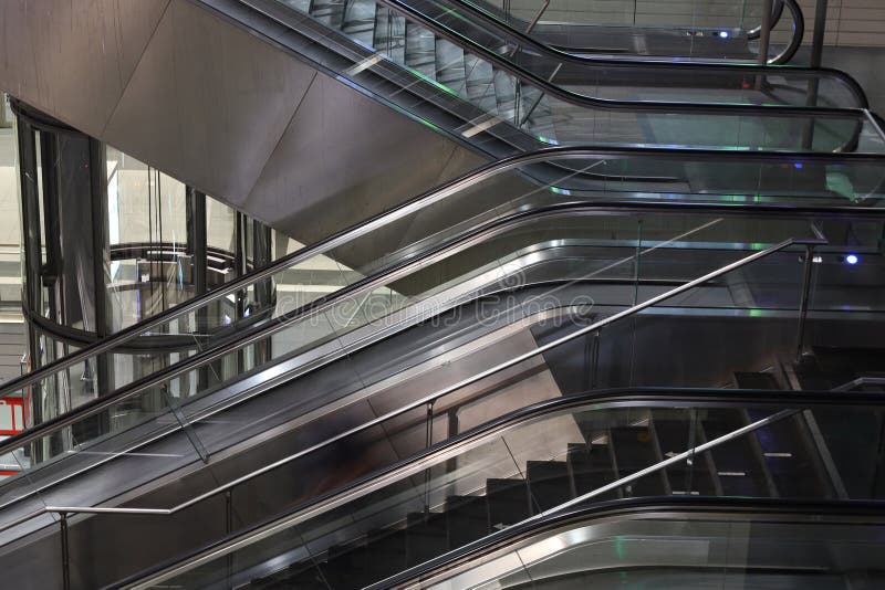Elevator Capsule Lift and Escalators in the Train Station Stock Photo