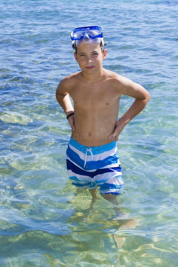 Three kids on a raft stock image. Image of ocean, masks 16578201