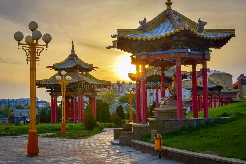 Buddhist pavilions in the Golden Abode temple in Elista at sunset