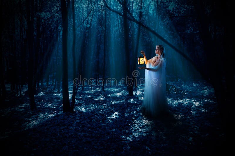 Elven girl with lantern at night forest