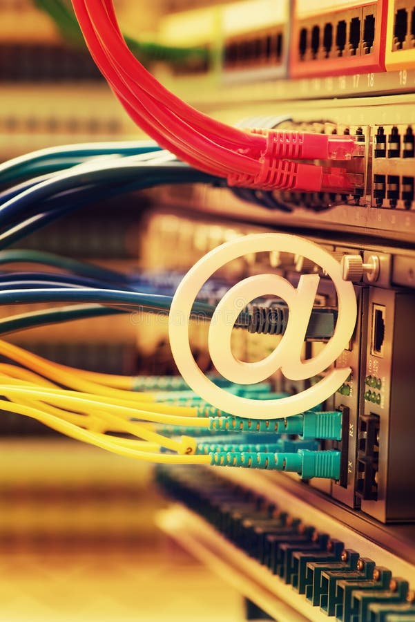 Email symbol on Network switch and ethernet cables royalty free stock images