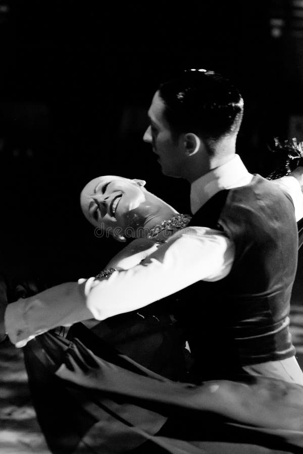 BUCHAREST - APRIL 01: Emanuel Valeri and Tania Kehlet, the World Ballroom Standard Champions performing a viennese waltz demonstration at IDSF (International Dance Sport Federation) Dance Masters on April 01, 2012 in Bucharest, Romania. BUCHAREST - APRIL 01: Emanuel Valeri and Tania Kehlet, the World Ballroom Standard Champions performing a viennese waltz demonstration at IDSF (International Dance Sport Federation) Dance Masters on April 01, 2012 in Bucharest, Romania