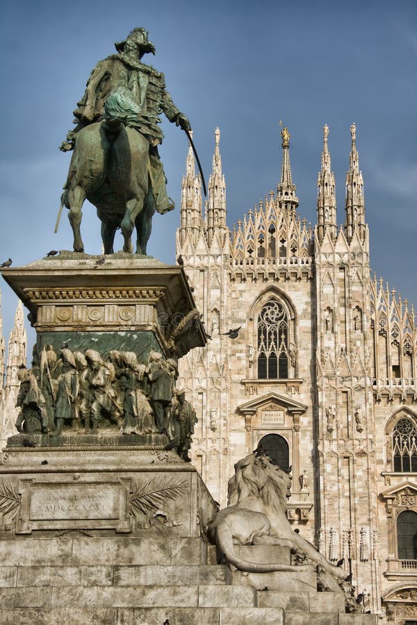 Picture of Vittorio Emanuele II Statue (Ercole Rosa, 1896) in Piazza del Duomo, Milan, Italy; Milan Cathedral Duomo di Milano on the background. Picture of Vittorio Emanuele II Statue (Ercole Rosa, 1896) in Piazza del Duomo, Milan, Italy; Milan Cathedral Duomo di Milano on the background