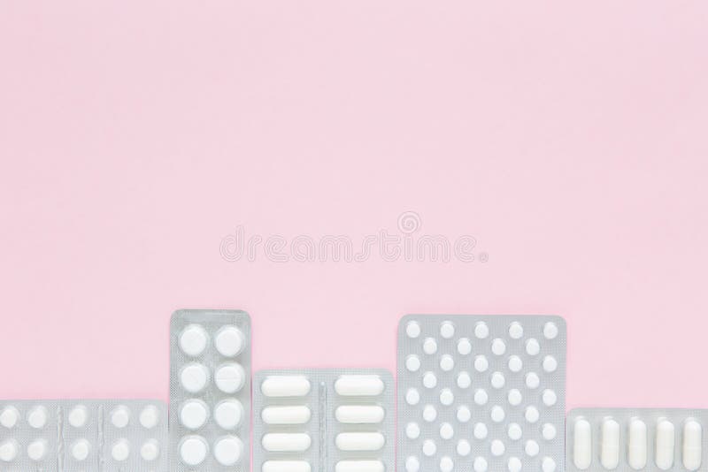 Packaging of white pills and capsules with medicine on pink background. Women Health. Diseases of inhabitants of megalopolis. Copy space. Packaging of white pills and capsules with medicine on pink background. Women Health. Diseases of inhabitants of megalopolis. Copy space.