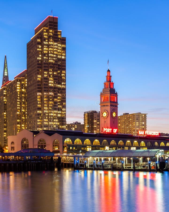 Embarcadero Towers and Ferry Building in San Francisco, illuminated in SF 49ers red and gold colors.