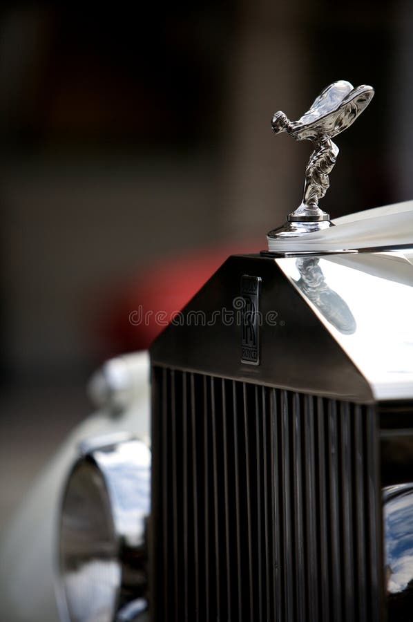Classic white rolls royce with the famous flying lady emblem / mascot. Classic white rolls royce with the famous flying lady emblem / mascot