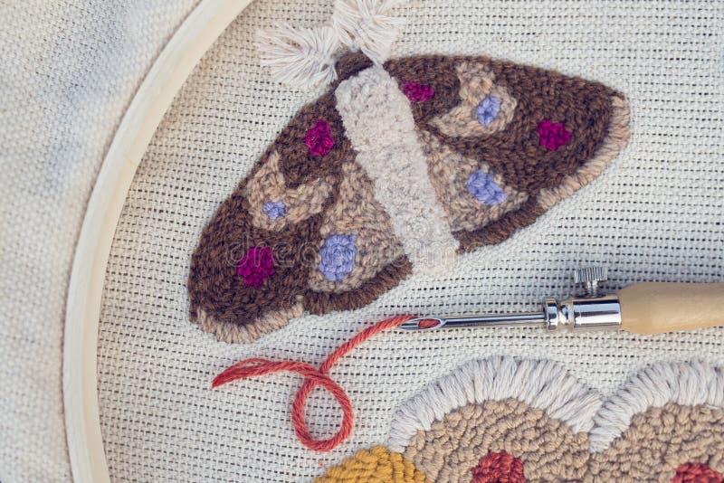 Embroidered Butterfly and Punch Needle with Red Thread Closeup. Idea of