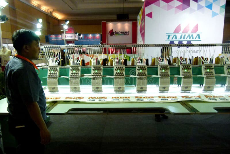 Embroidery machine editorial photography. Image of expo 68432162