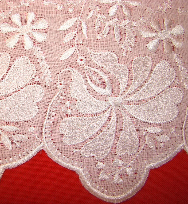Embroidery rishelye on a white batic
