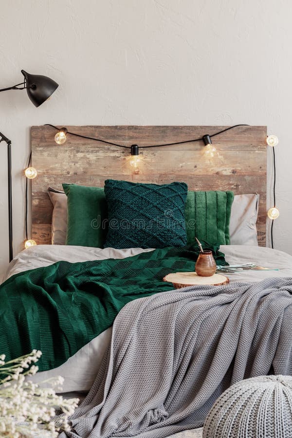 Emerald Green Pillows and Blanket on Wooden King Size Bed with Grey