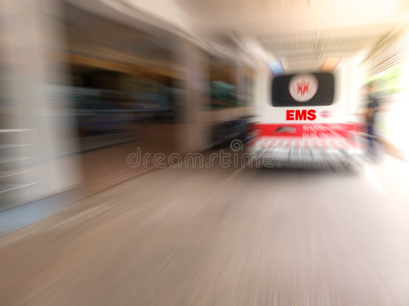 Emergency medical staff team transporting patient to hospital with ambulance into an Accident & Emergency ward of a hospital. EMS. royalty free stock photography Emergency medical staff team transporting patient to hospital with ambulance into an Accident & Emergency ward of a hospital. EMS. royalty free stock photography