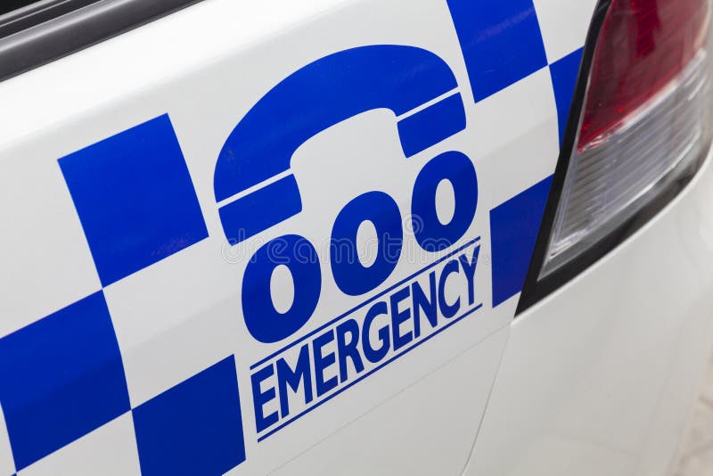 Emergency number 000 in Australia on a police car. Emergency number 000 in Australia on a police car