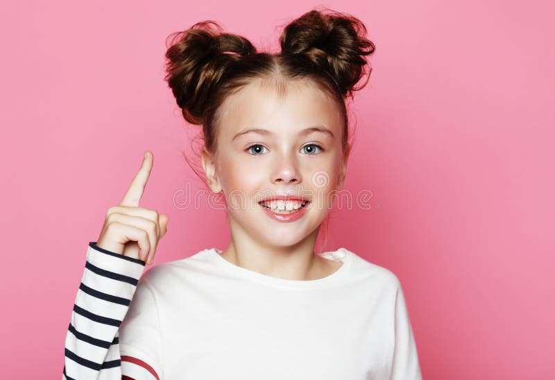 Close up portrait of a cute little girl of 7-8 years old leaning to pink  wall Stock Photo by ©annanahabed 122304756