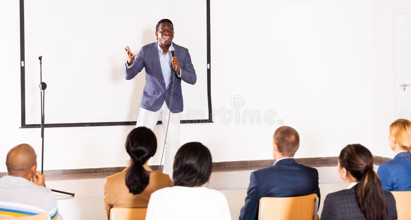 Emotional aframerican business coach giving motivational training stock photography