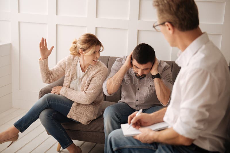 Emotional angry couple having a quarrel stock image Emotional angry couple having a quarrel stock image