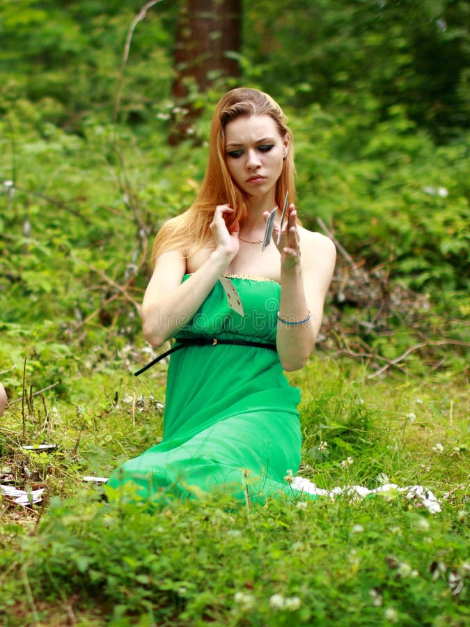 Emotional Blonde, Play Cards, Throws Cards on the Grass. Stock Photo ...