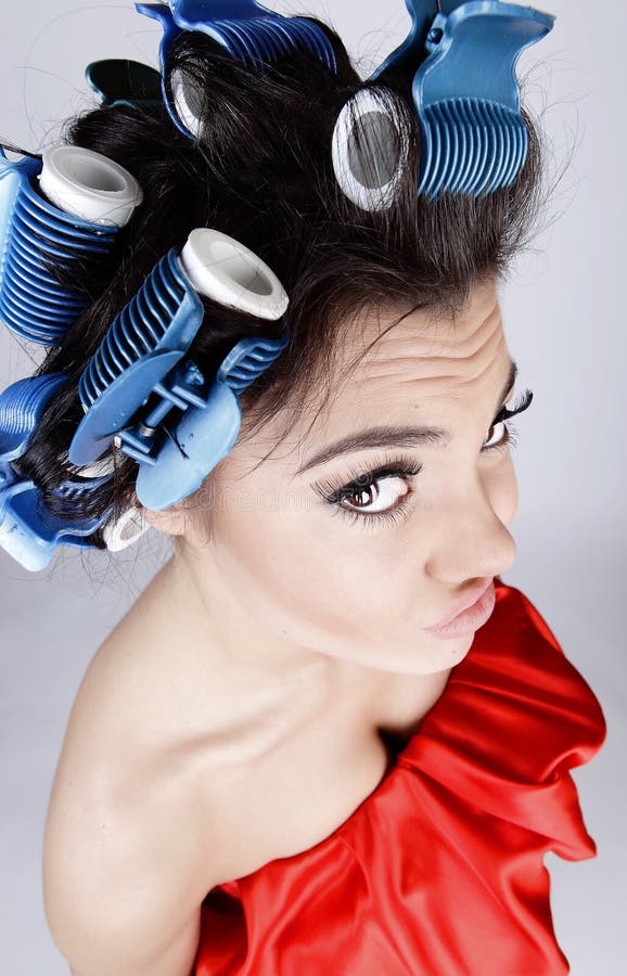 Emotional Girl with hair-curlers on her head