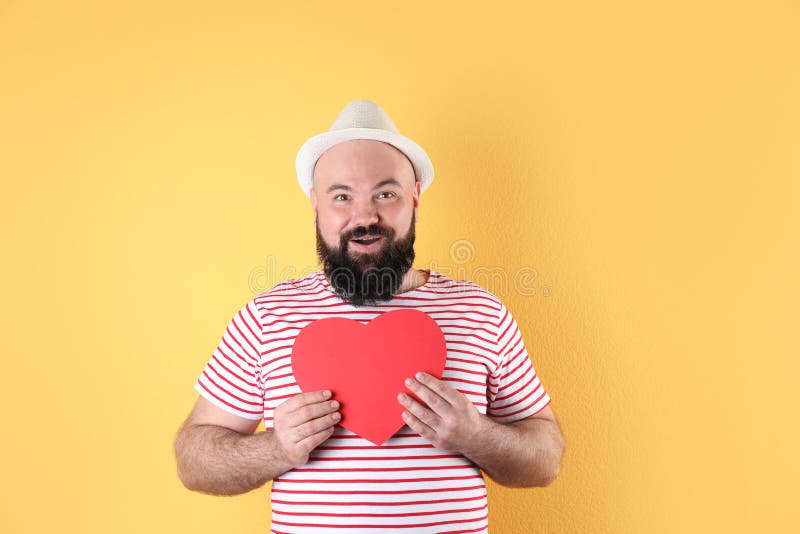 Emotional man with paper heart stock images Emotional man with paper heart stock images