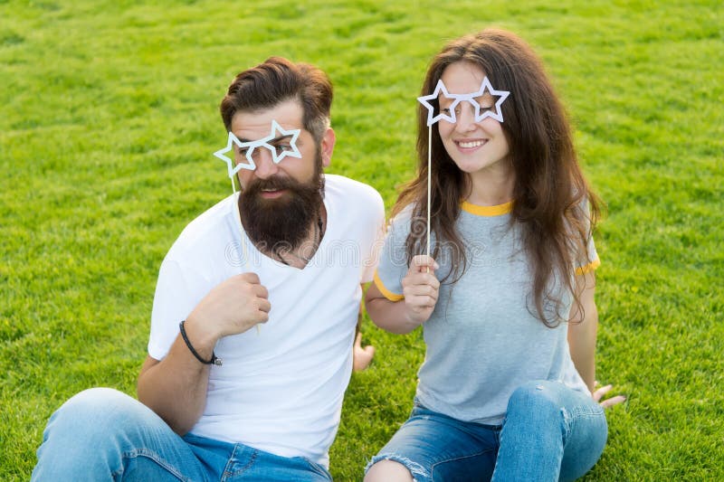Emotional people. Couple dating. Carefree couple having fun green lawn. Man bearded hipster and pretty woman cheerful royalty free stock photos Emotional people. Couple dating. Carefree couple having fun green lawn. Man bearded hipster and pretty woman cheerful royalty free stock photos