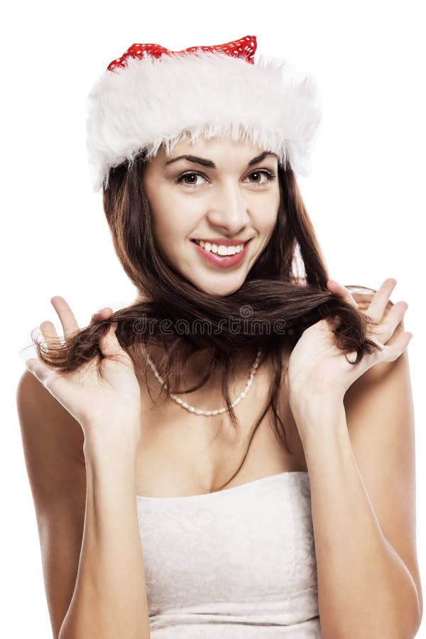 Emotional portrait of a beautiful young woman in a Santa Claus hat. New Year mood. Isolated over white background. royalty free stock photography Emotional portrait of a beautiful young woman in a Santa Claus hat. New Year mood. Isolated over white background. royalty free stock photography