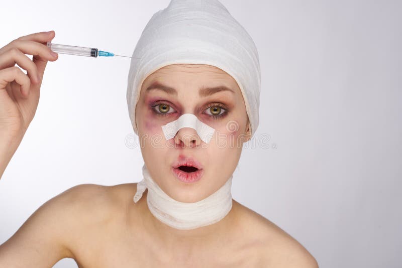 Emotional Woman Bandaged Face The Syringe Sticks Out In The Head Light Background Stock Image