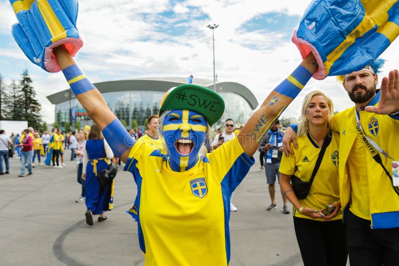 Emotional woman fan supporting of Sweden national football team.