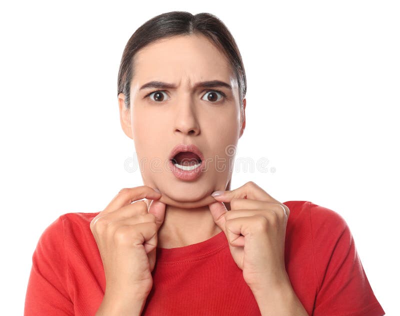 Emotional young woman with double chin on background stock photo Emotional young woman with double chin on background stock photo