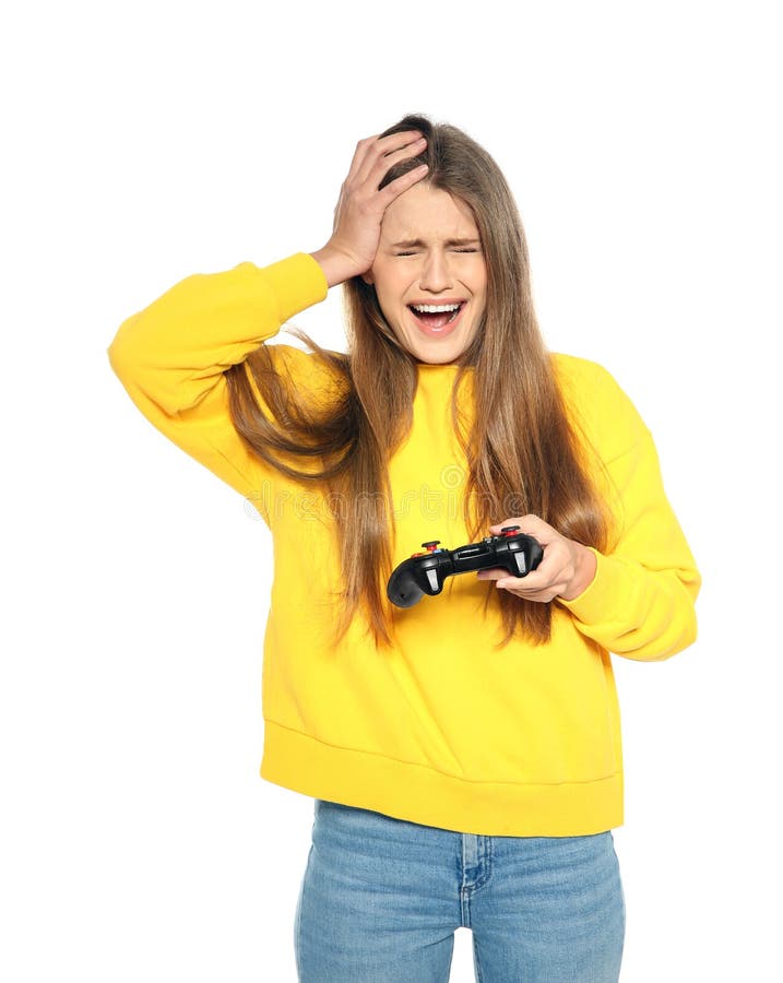 Emotionale junge Frau, die Videospiele mit dem Prüfer lokalisiert spielt lizenzfreie stockbilder Emotionale junge Frau, die Videospiele mit dem Prüfer lokalisiert spielt lizenzfreie stockbilder