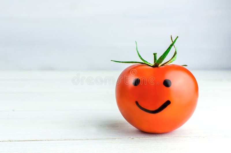 emotions on tomatoes. Smile. Joy. Happy. White background