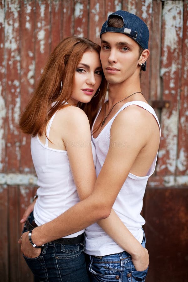 Emotive Portrait Of A Stylish Couple In Jeans Standing Together Stock Image Image Of Beauty