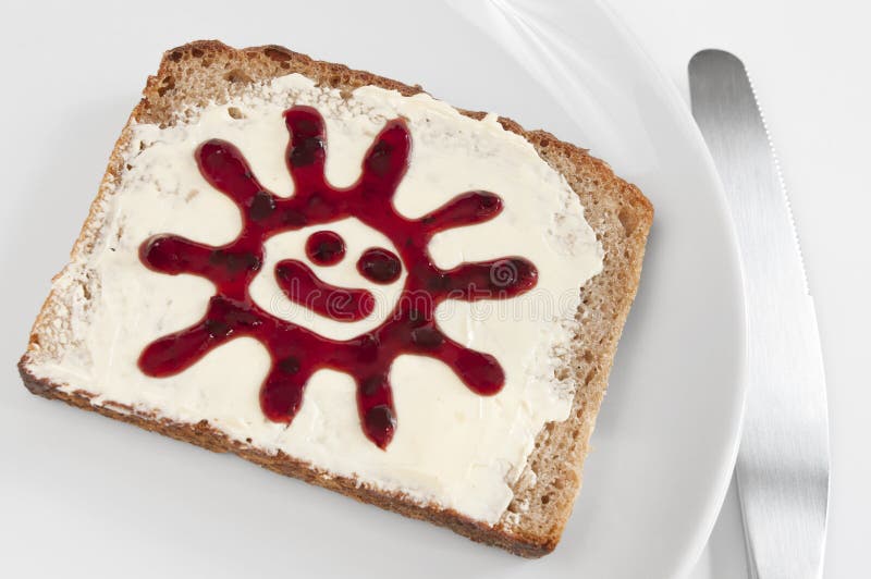 Emparedado del desayuno con el sol del atasco foto de archivo libre de regalías Emparedado del desayuno con el sol del atasco foto de archivo libre de regalías