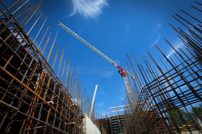 Construction site with cranes and buildings on sky background. Construction site with cranes and buildings on sky background