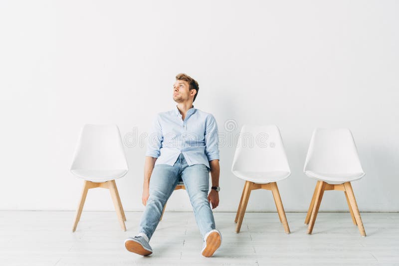 Employee Looking Up while Sitting on Chair in Office Stock Image ...