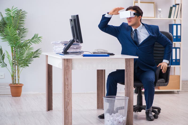 The Employee Using Virtual Reality Glasses in Office Stock Image